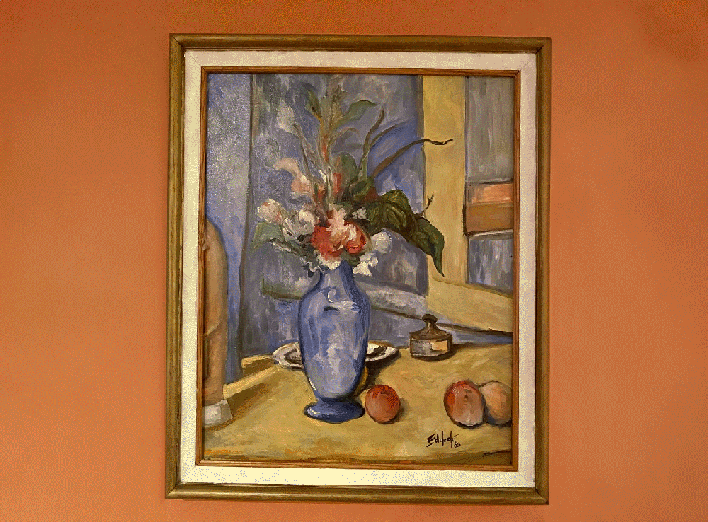 Image of a still life of a blue vase and flowers