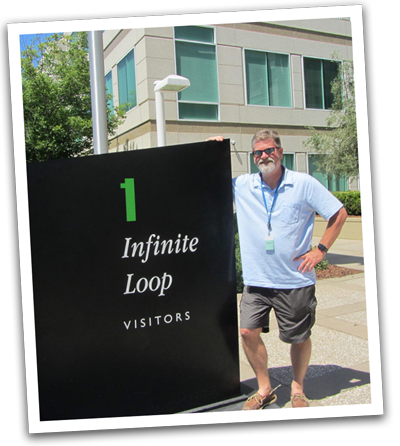 Eric standing beside the 1 Infinite Loop sign at Apple Inc.
